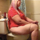 A full-figured blonde woman with glasses is recorded taking a piss and a shit while sitting on a toilet and then wiping herself. Nice, audible pissing and shitting sounds. About 7.5 minutes.
